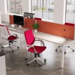 executive office chair in red fabric around office desk