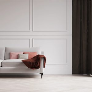 grey fabric sofa with cushions and a throw on it