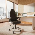 high back black leather executive office chair in office