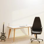 high back black leather executive office chair in front of skandi style office desk