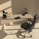 high back black leather executive office chair in front of grey height adjustable desk