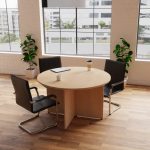 meeting chair in black leather with chrome cantilever frame around round beech meeting table
