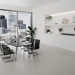 meeting chair in black leather with chrome cantilever frame around boardroom table with city view
