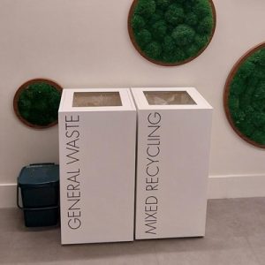 office recycling bins in row. Office waste bins white with black lettering