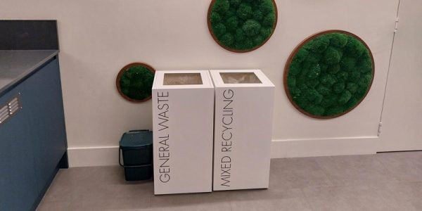 office recycling bins in row. Office waste bins white with black lettering