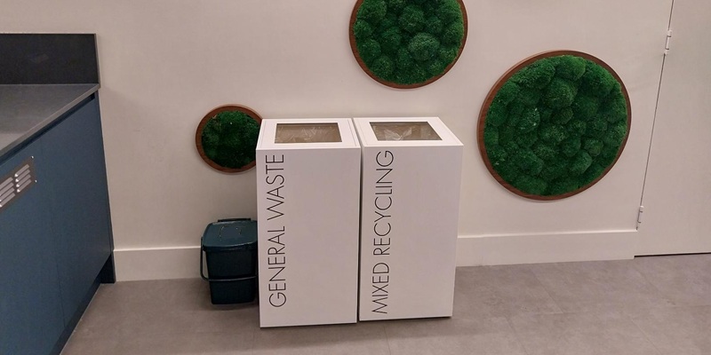 office recycling bins in row. Office waste bins white with black lettering