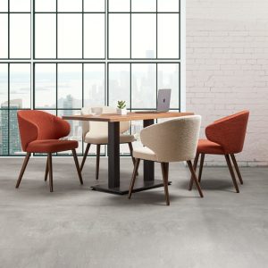 contemporary cafe armchair in boucle fabric around rectangular table