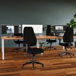 high back task operator chair in office in front of office desk