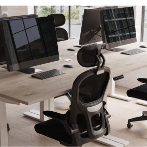 mesh back task operator chairs around a grey oak office desk