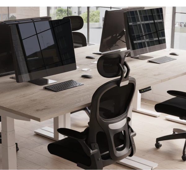mesh back task operator chairs around a grey oak office desk