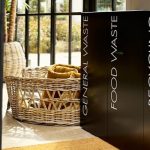 office recycling bins for public areas black in a row of 3 with white lettering