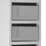 post box pigeon holes with grey carcass and doors close up