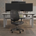 mesh back office chair in office in front of an office desk
