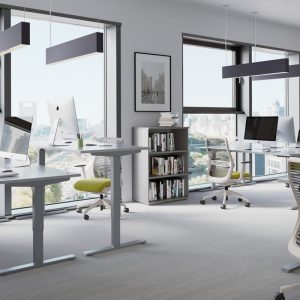 sit - stand desk in office