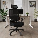 black mesh office chair in office in front of white office desk