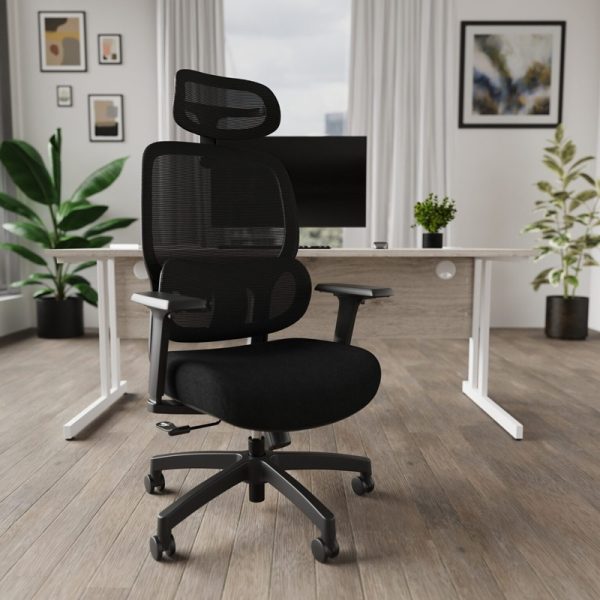 black mesh office chair in office in front of white office desk