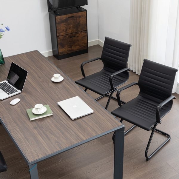 black visitor chair with black cantilever frame around office desk