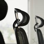 ergonomic office chair with mesh back and head rest close up