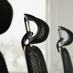 ergonomic office chair with mesh back and head rest close up