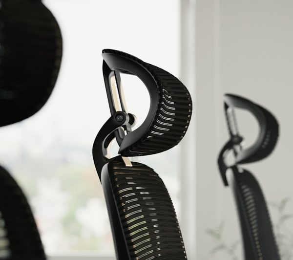 ergonomic office chair with mesh back and head rest close up