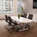executive office chair in black faux leather around boardroom table in office