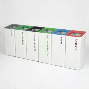 modern metal recycling bin clearly marked for different waste streams