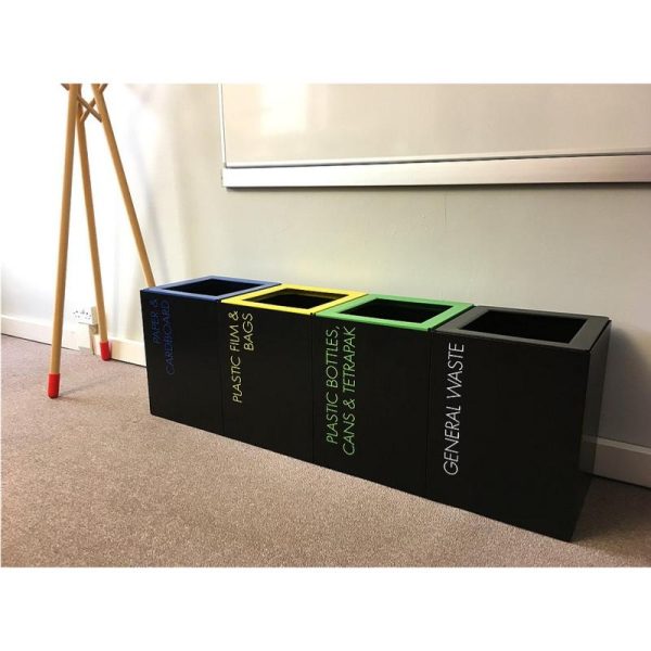 row of short office recycling waste bins with coloured tops and lettering