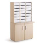 steel door pigeon holes with 21 compartments on wooden door mail room cupboard
