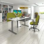 standing desk in office with lime screen and office chair