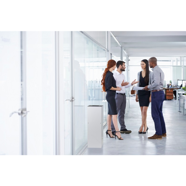 group of people in an office by white office recycling bin