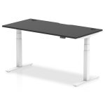 height adjustable desk with black desk top and white frame