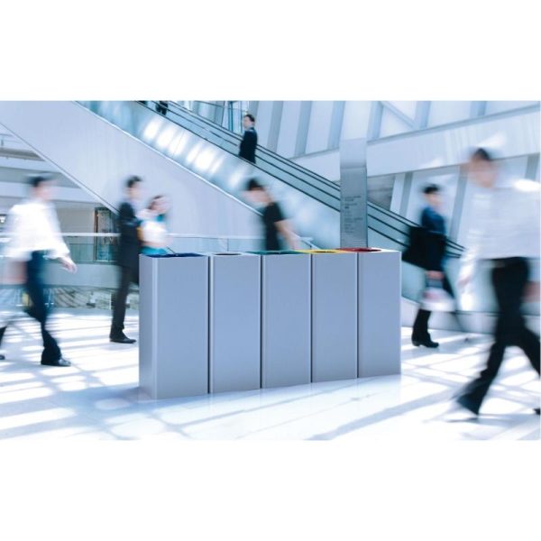 office recycling bins in a public area by escalators