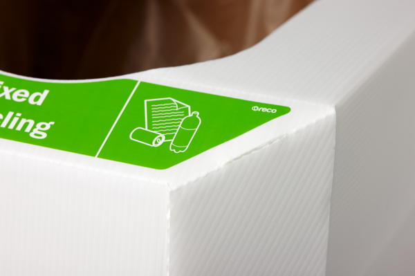 Recycling bin top showing green Mixed Recycling sticker
