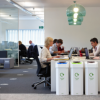 office setting with 3 cardboard office recycling bins