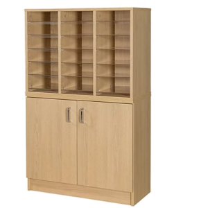 pigeon hole unit with 18 spaces in oak finish with acrylic shelves. Pigeon holes on top of mailroom cupboard