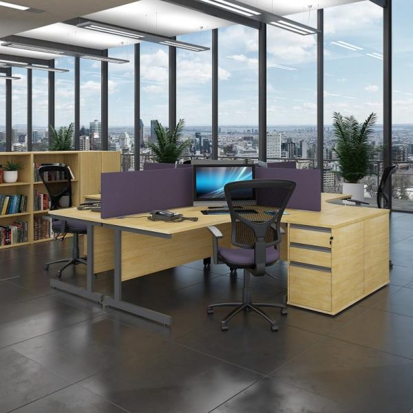 ergonomic desk in maple finish in room set with purple desk screens and mesh back office chairs. City view