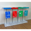 Row of transparent office recycling bins with coloured top and labels to indicate waste stream