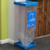 transparent office recycling bin with blue top and base and label