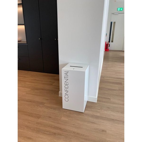 White confidential office recycling bin with black lettering Confidential