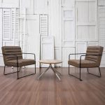 brown leather reception chair lounge chairs with black frame around a coffee table