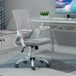swivel computer chair in grey mesh in front of home office desk