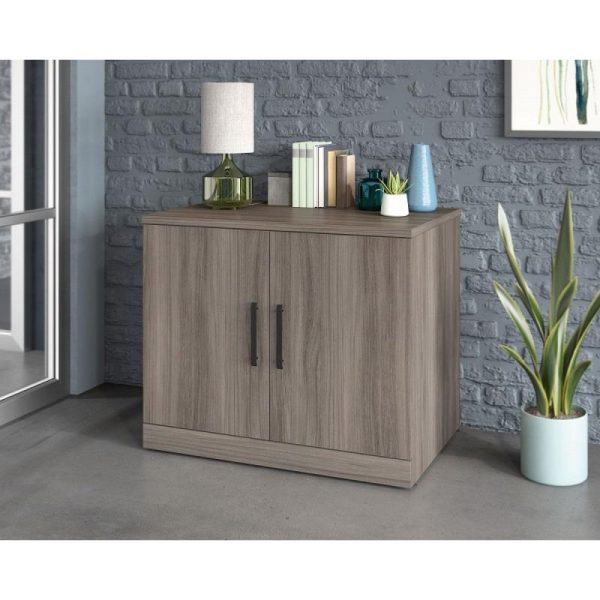 office storage cupboard in elm finish with accessories on top