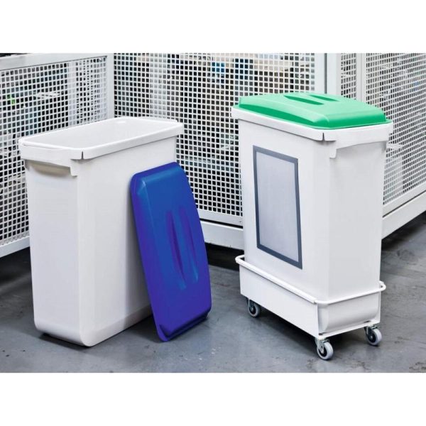 two grey office recycling bins in industrial setting. One with blue lid and one with green lid