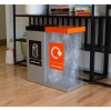 transparent office recycling bin with orange top and sticker and silver office recycling bin with black top and sticker