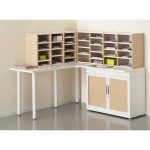 corner pigeon hole set up with one unit on post room table and 1 on mail room cupboard. IN light wood and white finish