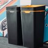 black office recycling bins with coloured tops for different waste