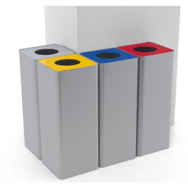 silver office recycling bins round a corner. With red , blue, yellow and silver tops to indicate waste stream