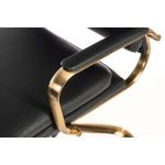 vintage style black leather office chair with brass coloured base and arms. Close up view