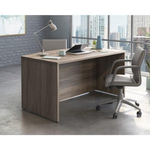 stylish office desk in attractive elm finish with panel ends. IN room set with office chair and city view