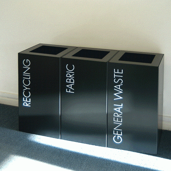 black office recycling bins with white lettering